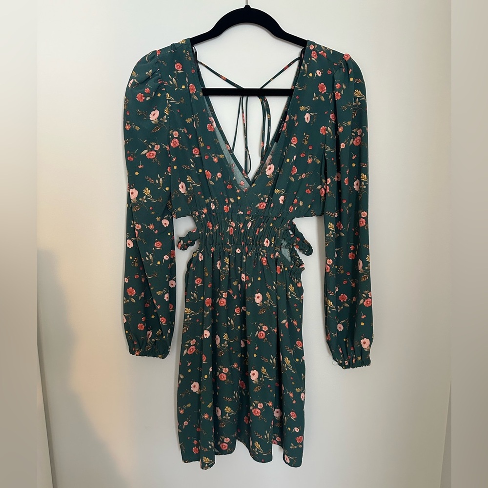 Green/floral mini dress with cut out sides and deep v neck